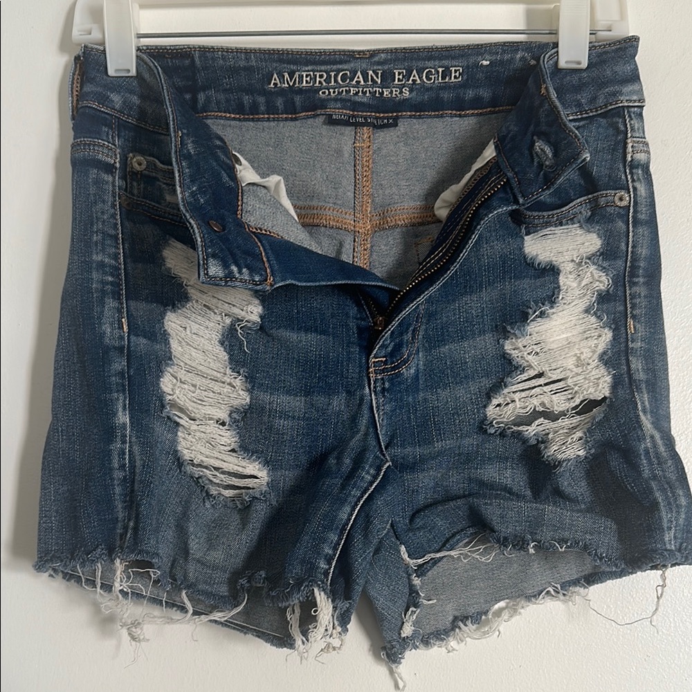 EUC American Eagle Next Level Stretch Blue Distressed Jean Shorts with Raw Hem - Picture 1 of 5